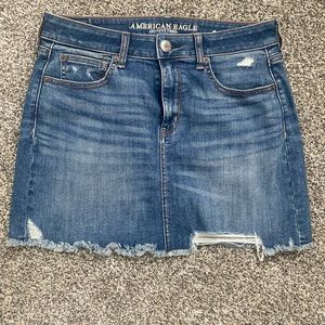 Distressed denim mini skirt